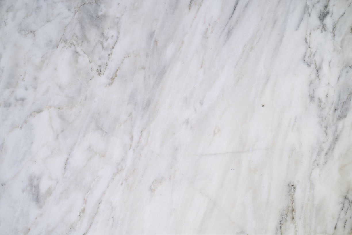 a close up of a white marble surface
