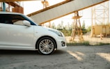a white car parked in front of a construction site
