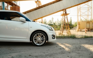 a white car parked in front of a construction site