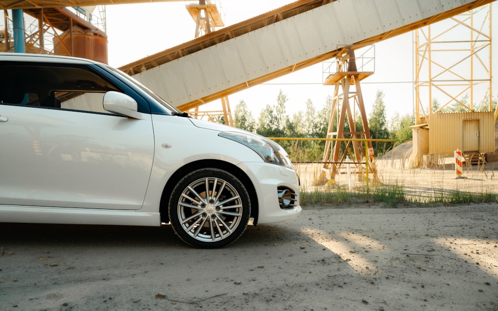 a white car parked in front of a construction site