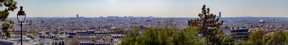 a view of a city from the top of a hill