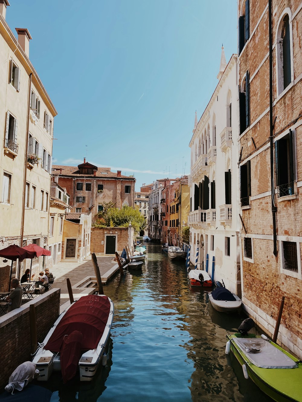 a canal with boats and buildings on both sides