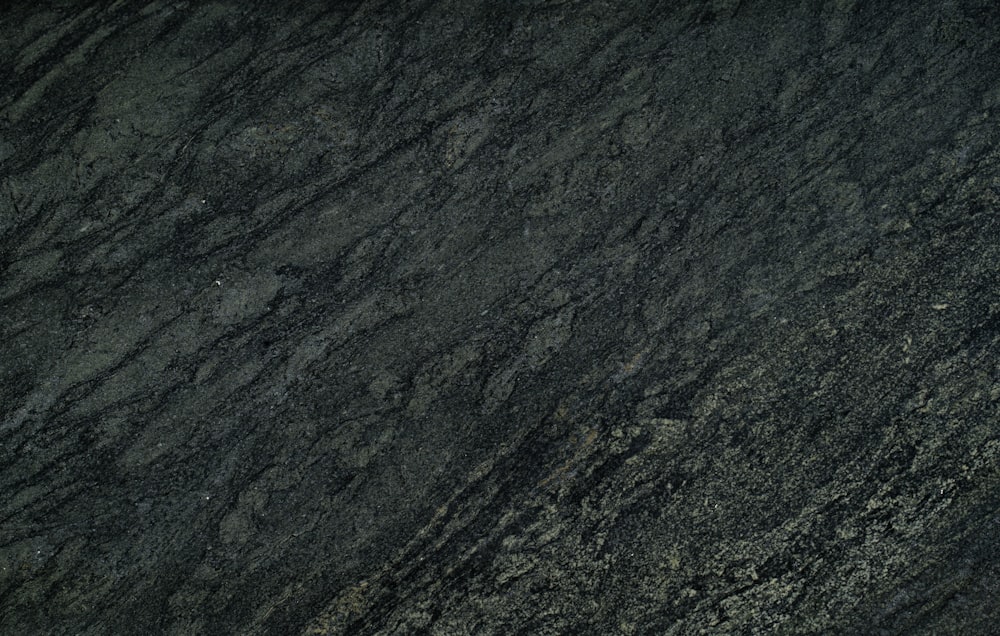 a close up of a black marble surface