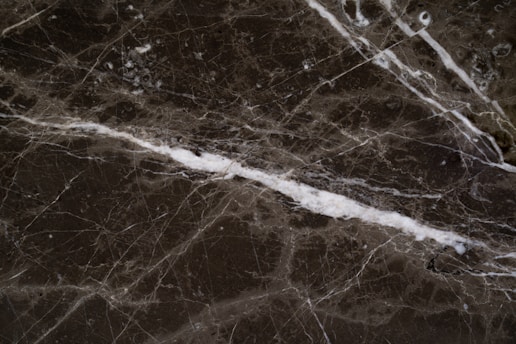 Close-up of a polished marble slab showing natural veins and textures.