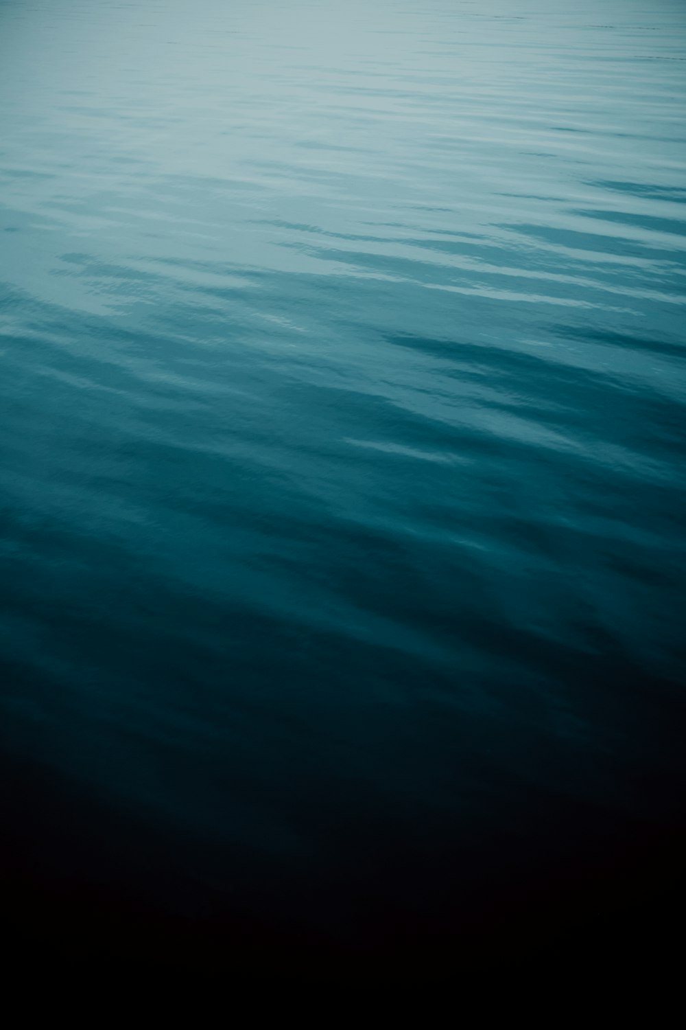 a boat floating on top of a large body of water