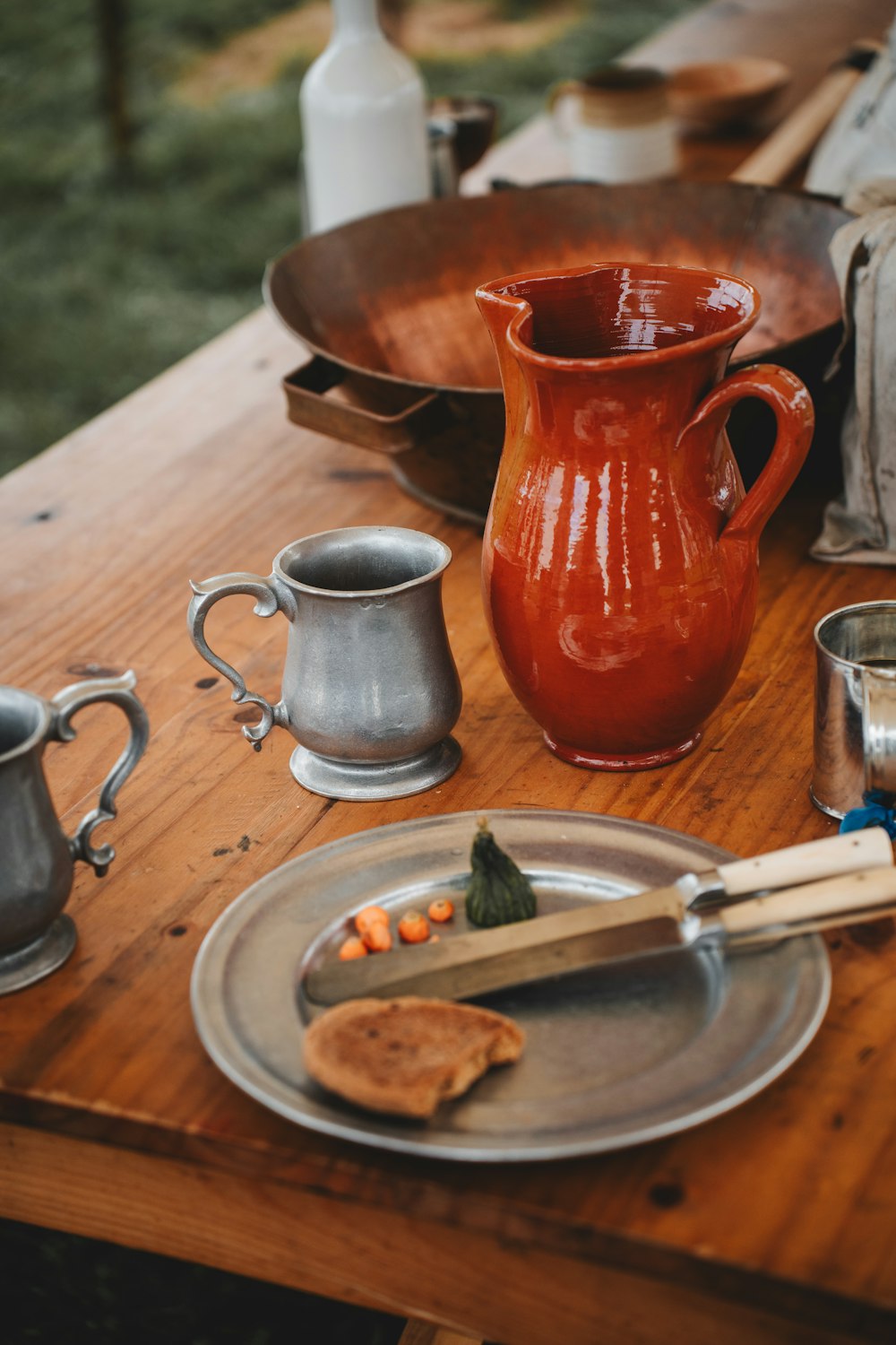 a wooden table topped with a plate of food