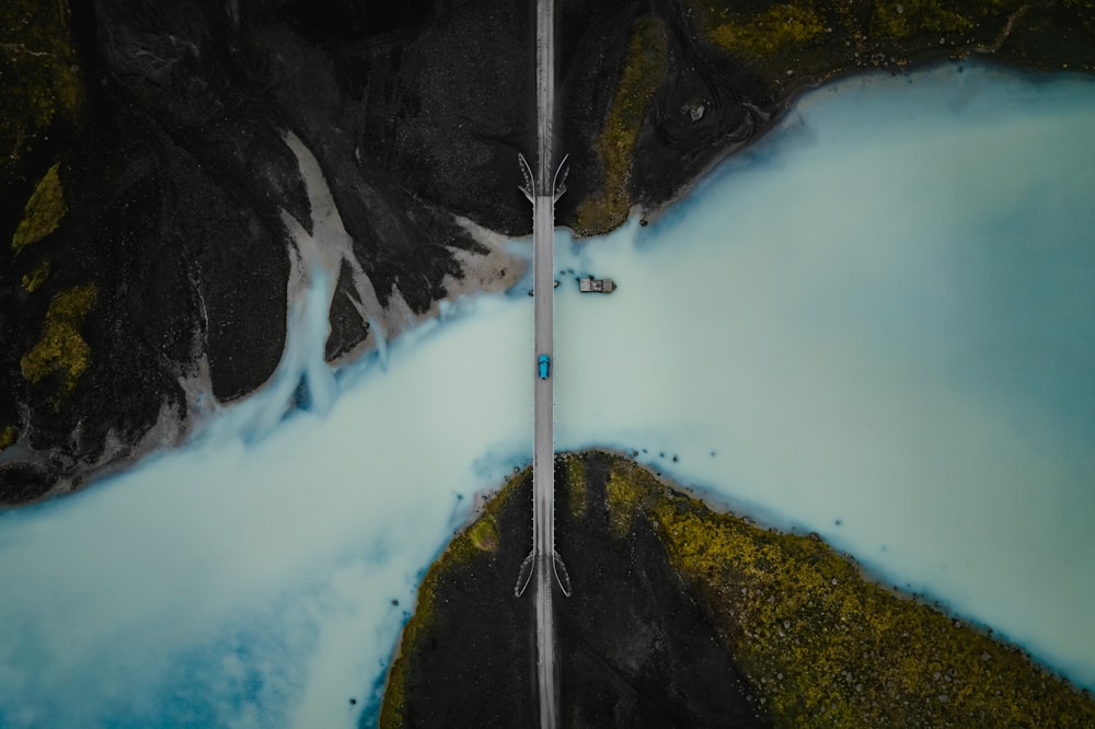 an aerial view of a road in the mountains