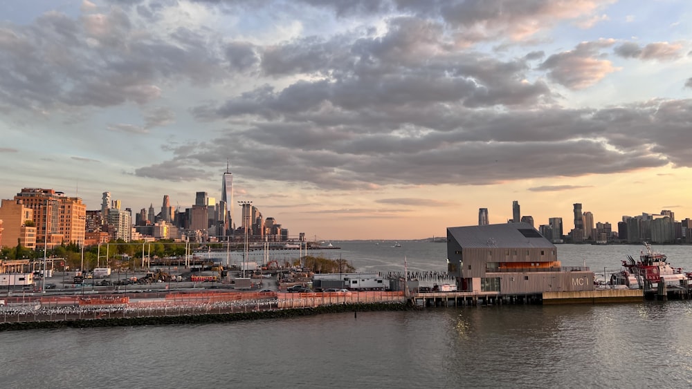 a large body of water with a city in the background