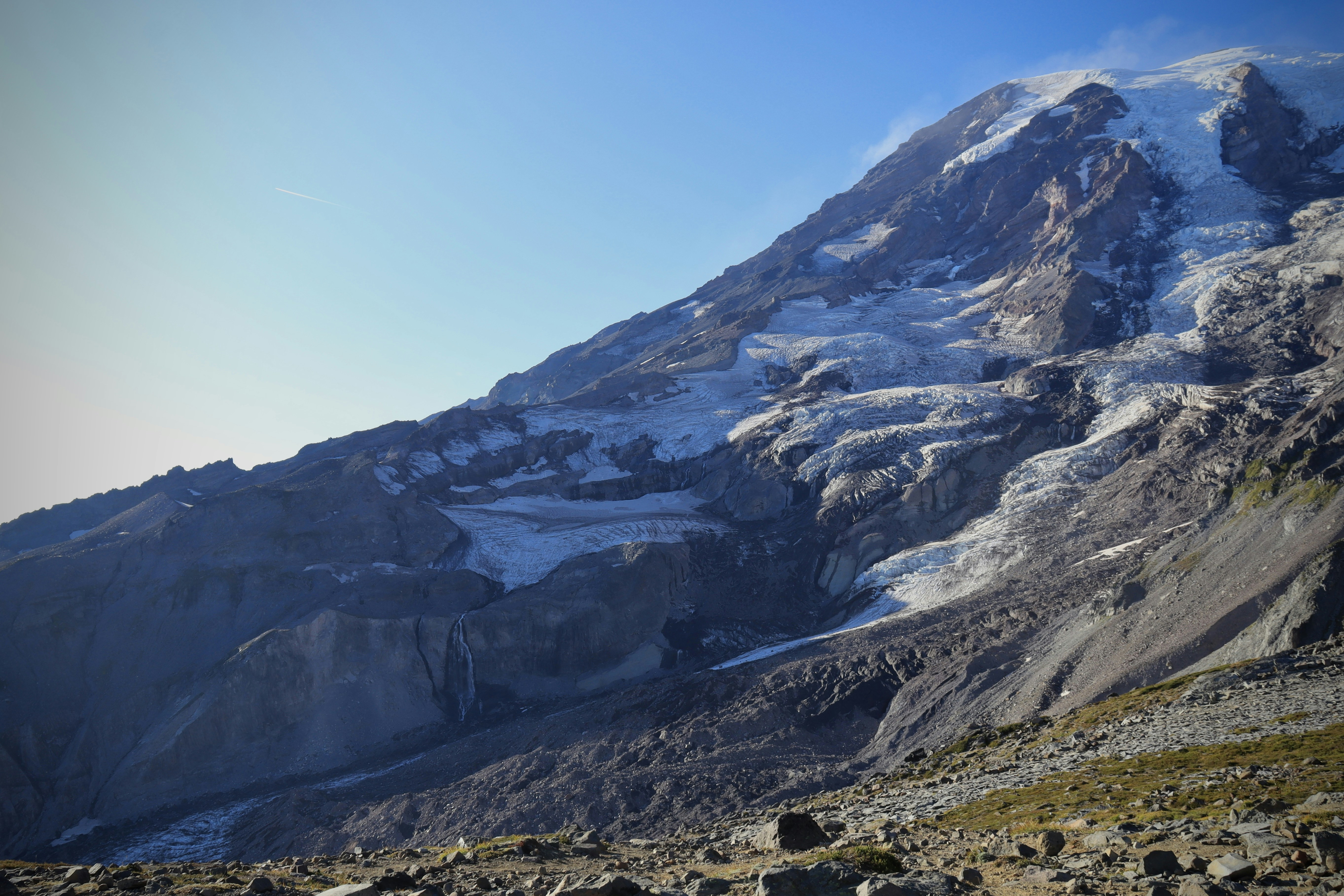 a mountain with a snow covered peak in the distance