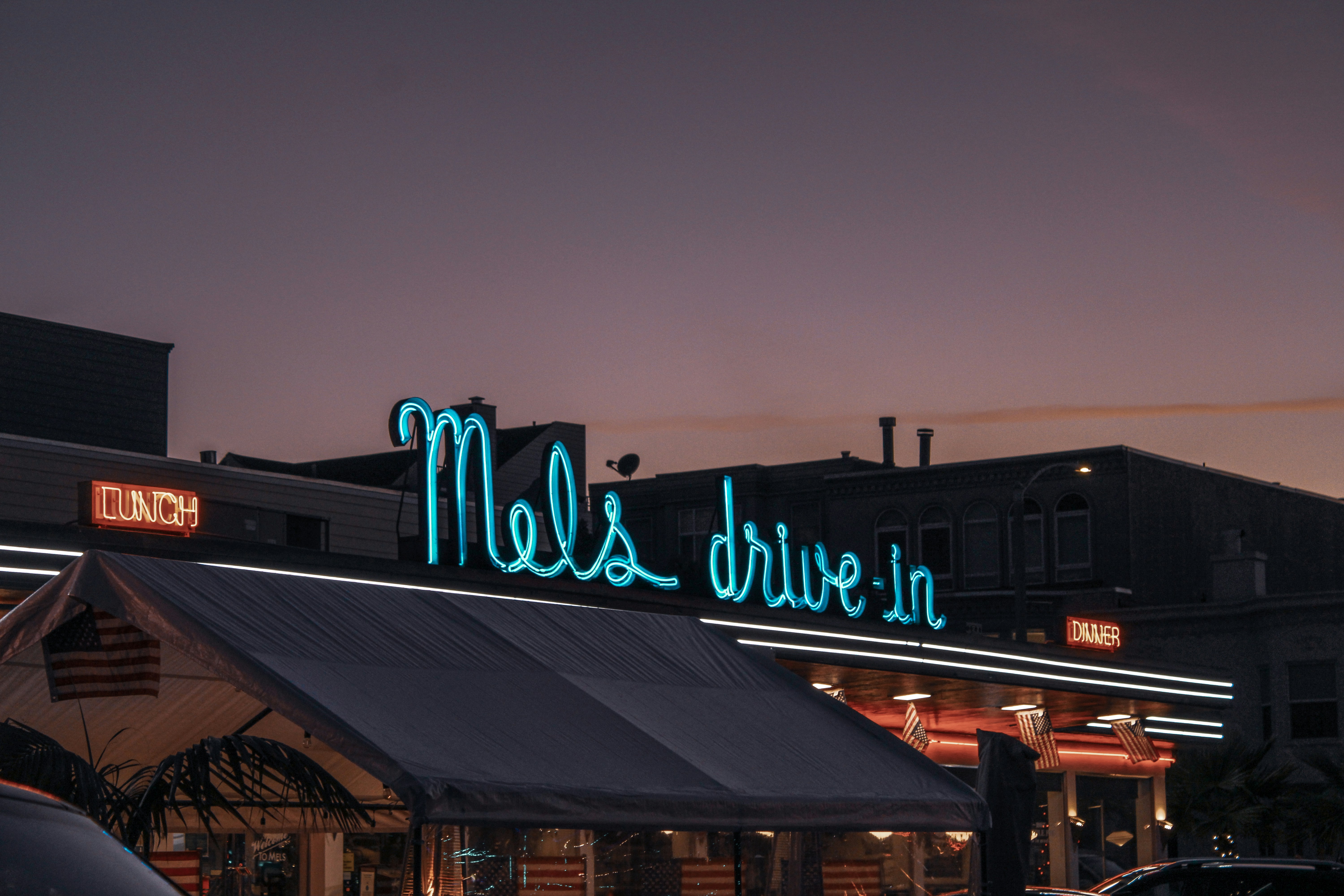 a neon sign that reads mel