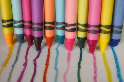 a group of crayons lined up in a row