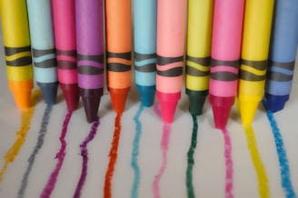 a group of crayons lined up in a row