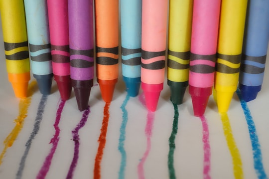 a group of crayons lined up in a row