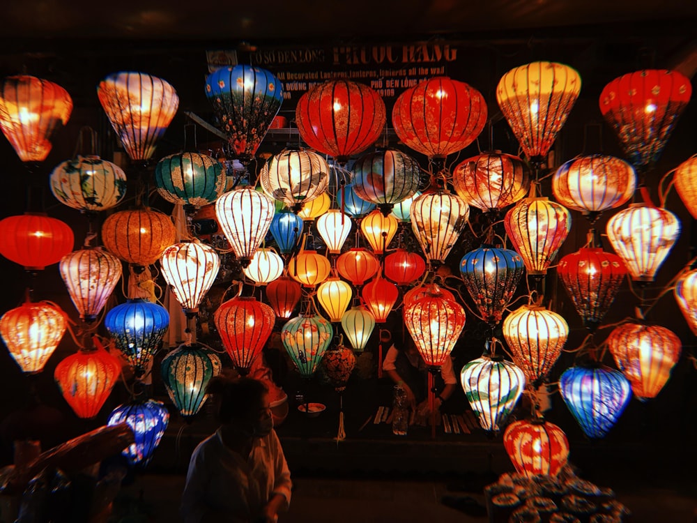 a bunch of lanterns are lit up in the dark
