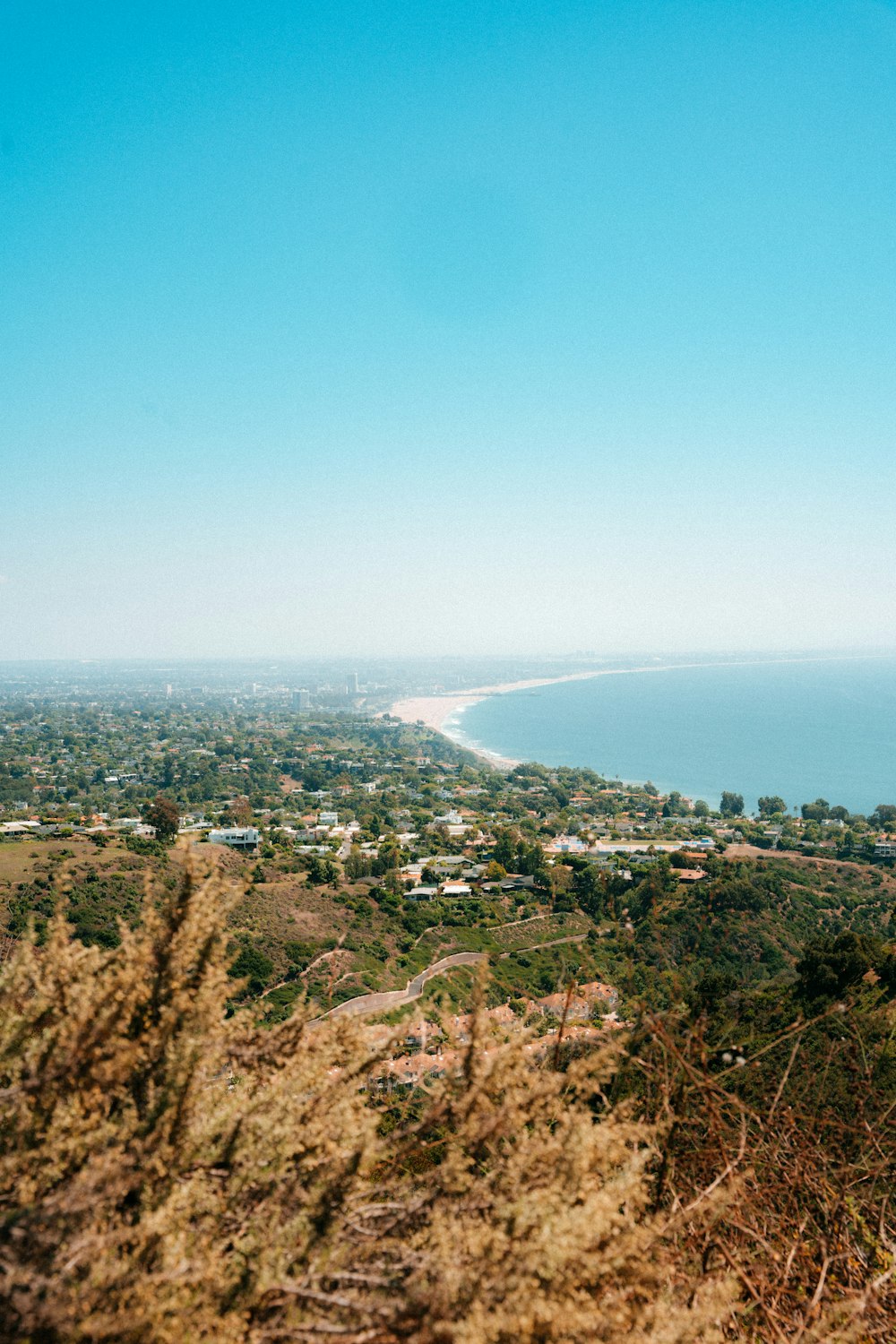 a view of the ocean from a hill top