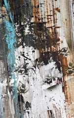 Abstract nature-inspired painting with turquoise and green hues.