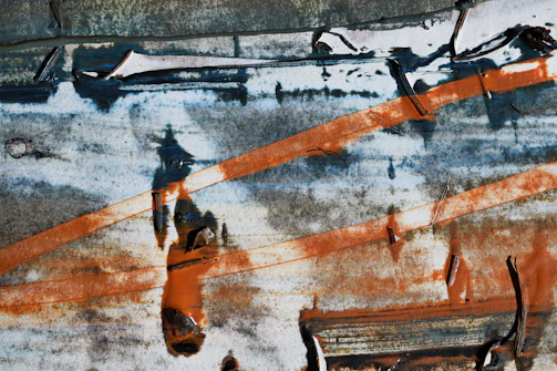 Close-up of rusted metal textures blending into shadowy, abstract shapes evoking a haunting rhythm.