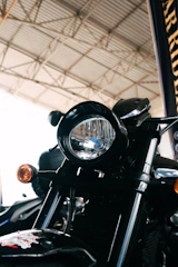 Close-up of premium motorcycle accessory details shining under showroom lights