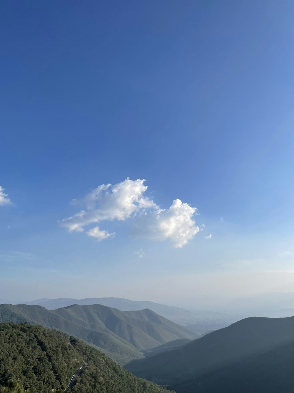 a view of a mountain range with a blue sky