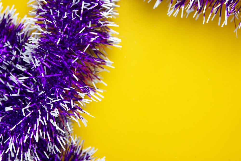 purple and white spiky decorations on a yellow background