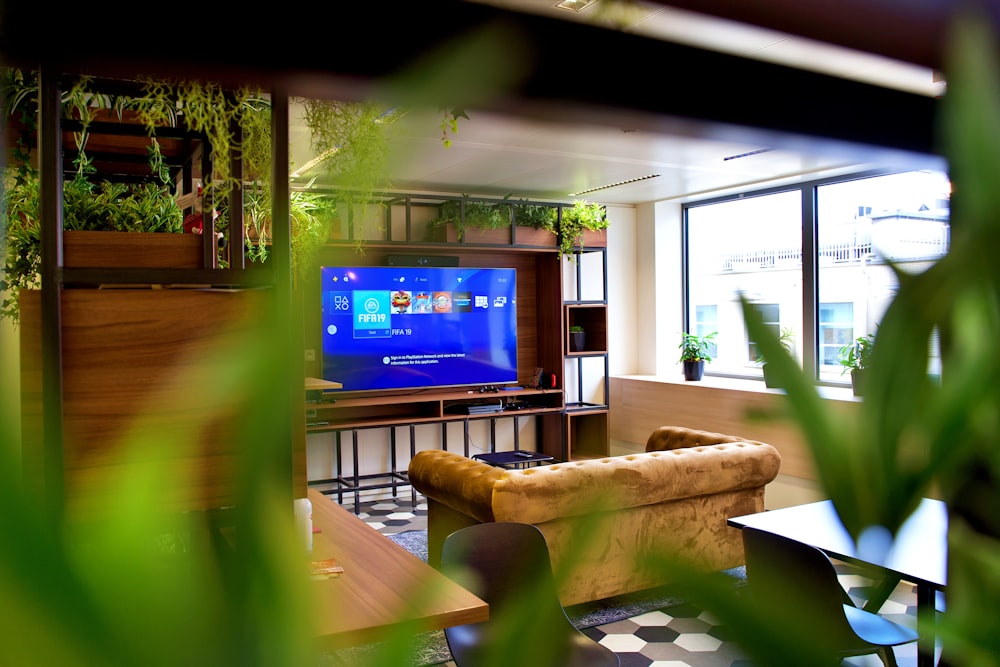 a living room filled with furniture and a flat screen tv