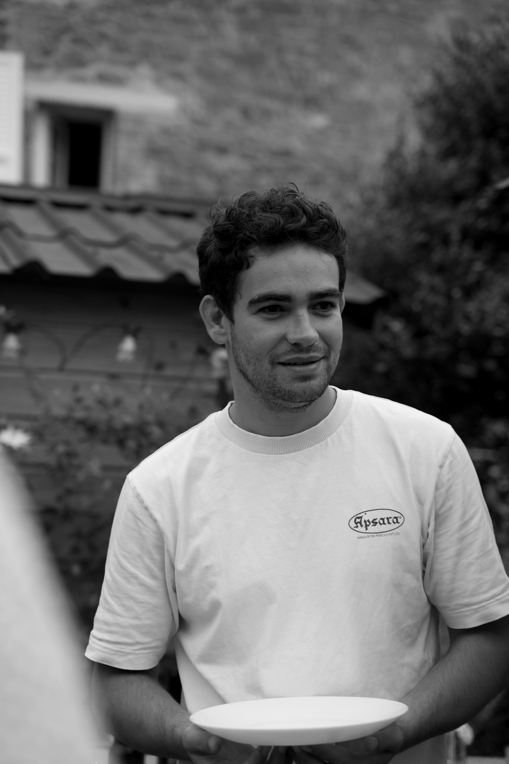 a man holding a white frisbee in his hands