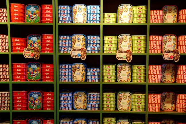 Photo showing a variety of Rio Mare canned tuna products neatly arranged on shelves.