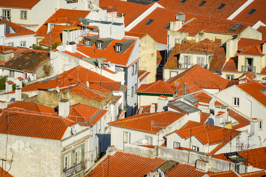 Red-tiled rooftops of Alfama seen from a Lisbon viewpoint