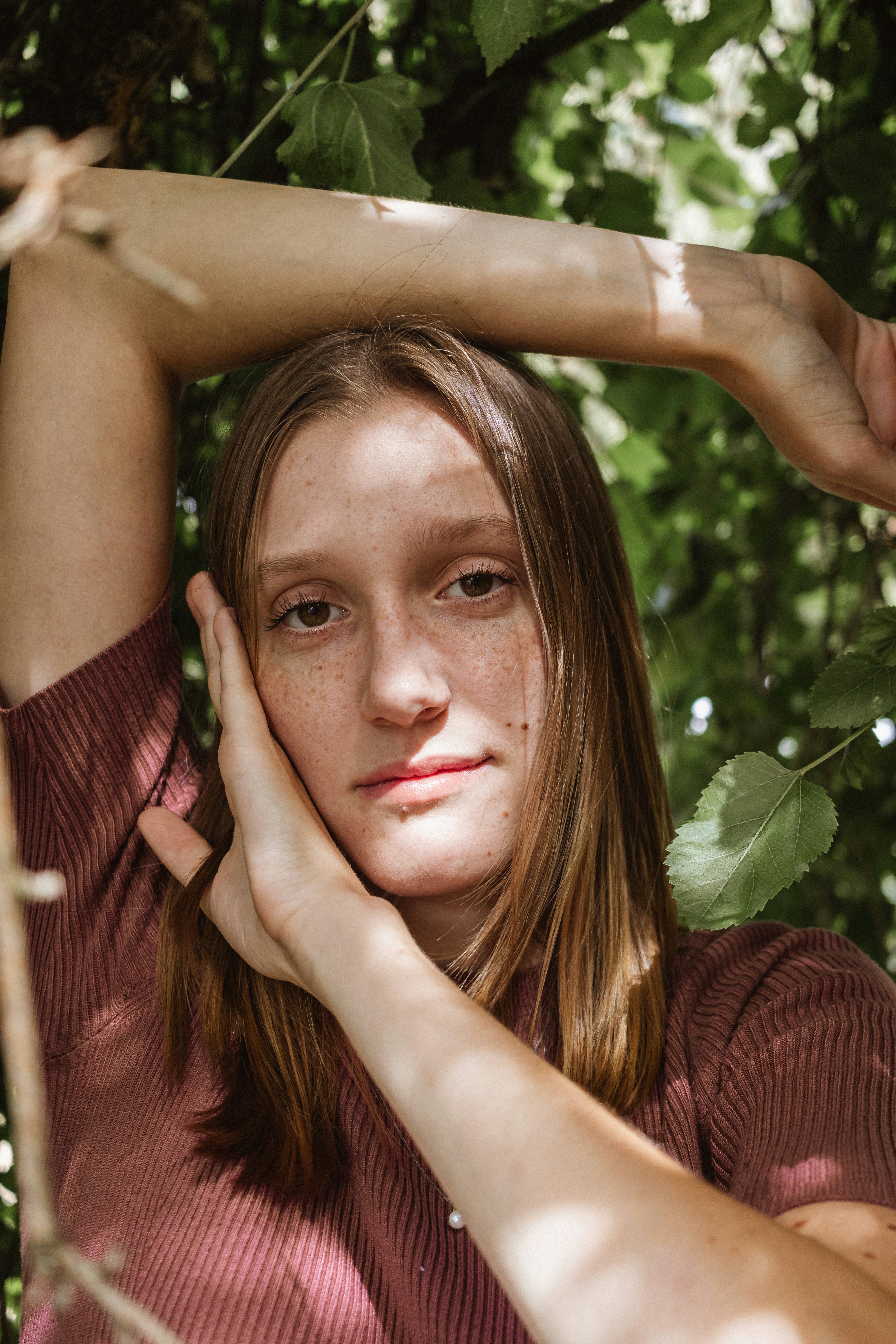 a woman with freckled hair is posing for a picture