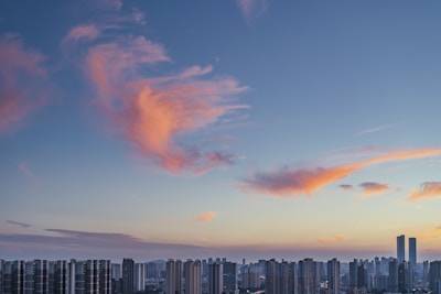 A colorful graph showing recent real estate market changes with a city skyline backdrop.