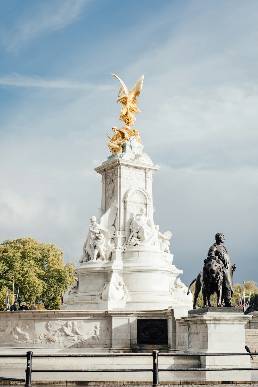 a statue of a man riding a horse in front of a building