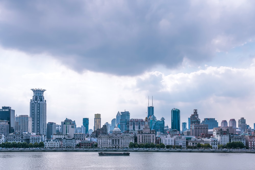 a large body of water with a city in the background