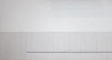 A minimalist wall art piece featuring soft pastel colors and clean lines