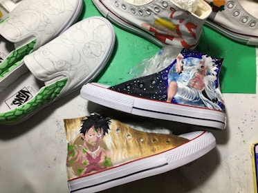 Artistic display of hand-painted sneakers with bold automotive-inspired graphics