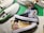 Custom-painted sneakers featuring vibrant anime character designs. The shoes have detailed and colorful illustrations, including elements like waves and various shades, with the artwork skillfully applied on the canvas surface.