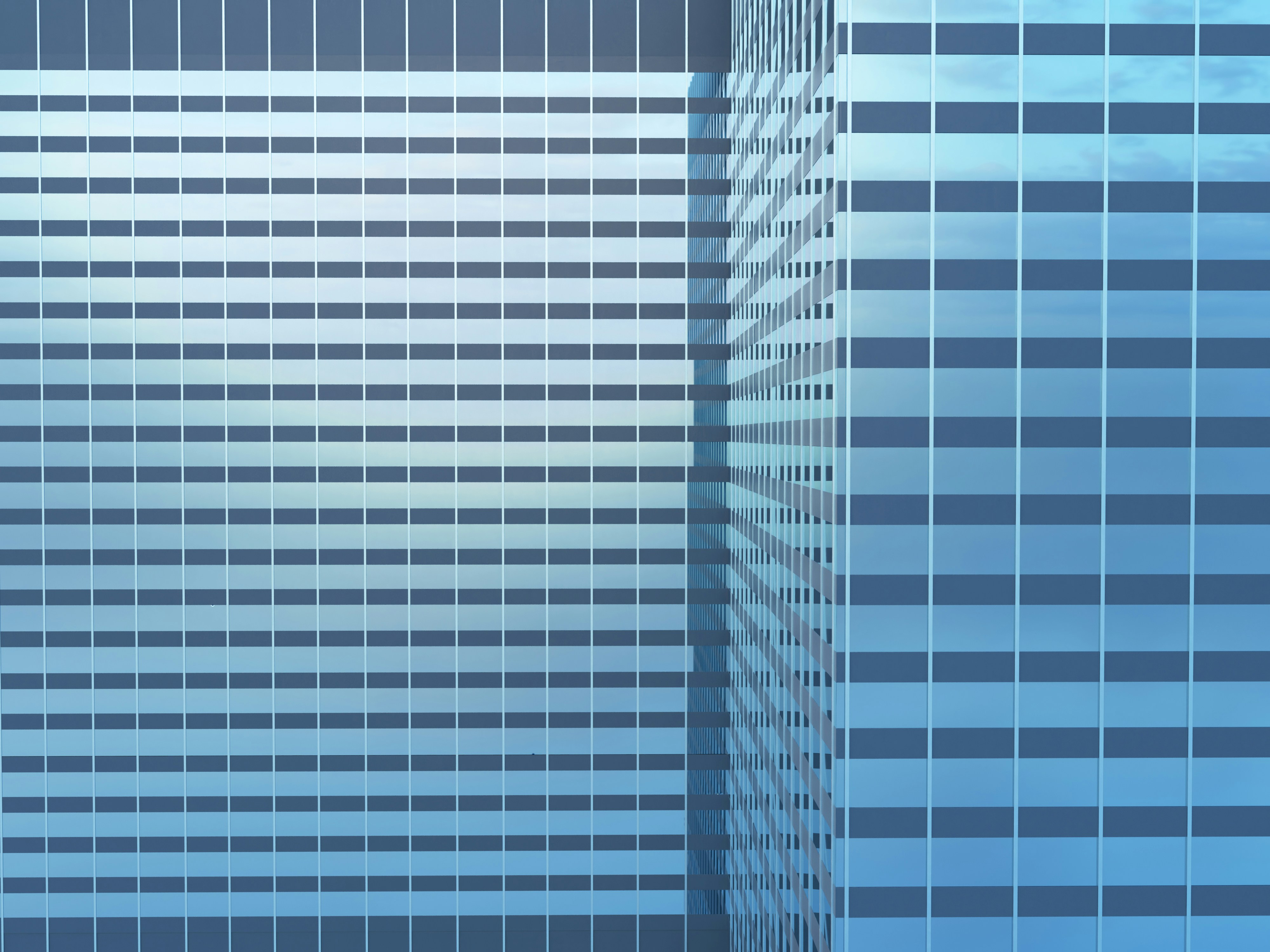 a tall building with a sky background