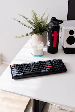 A minimalist workspace with a black and white color scheme and red accents.