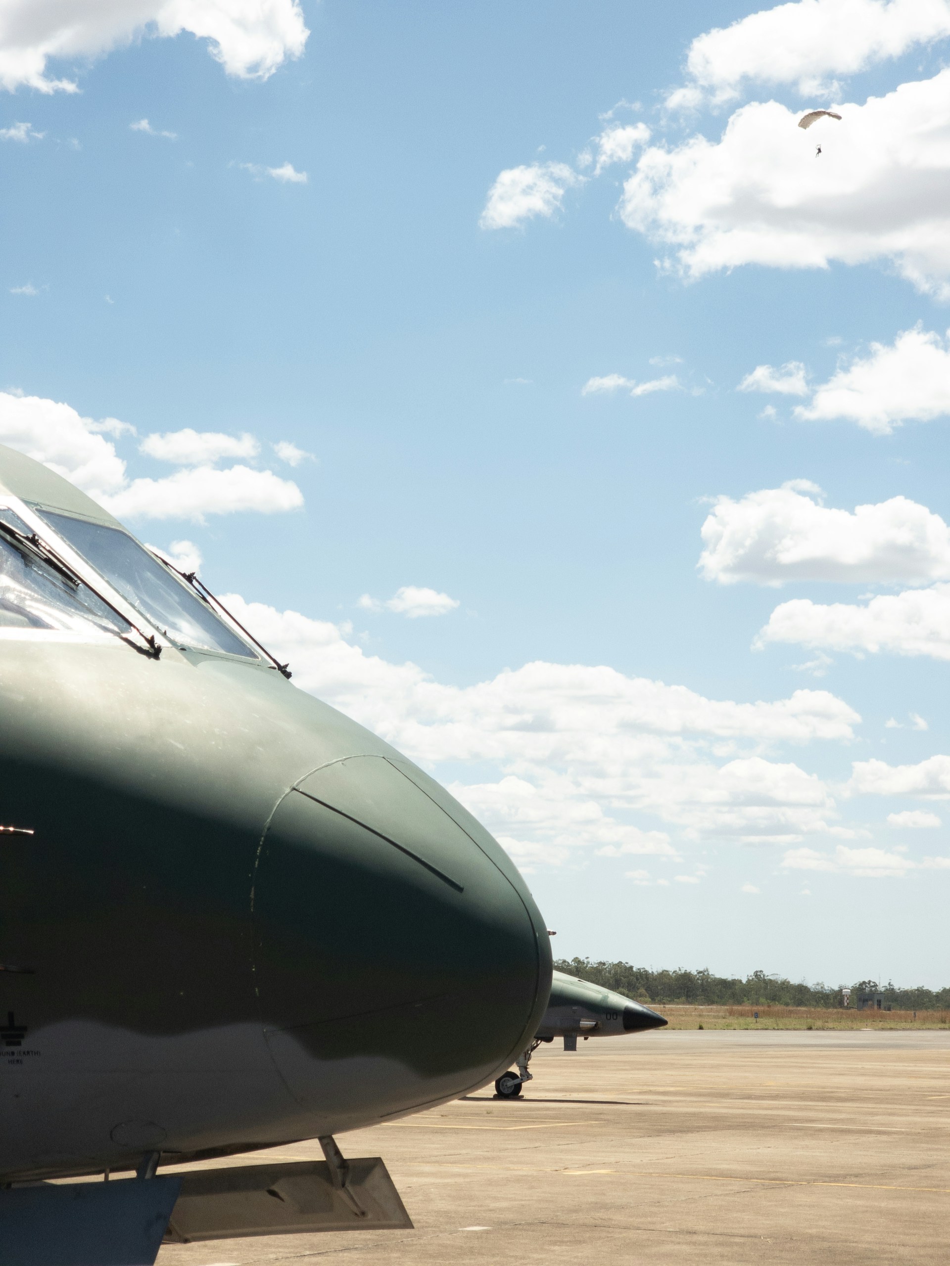 woman wearing yellow long-sleeved dress under white clouds and blue sky during daytime