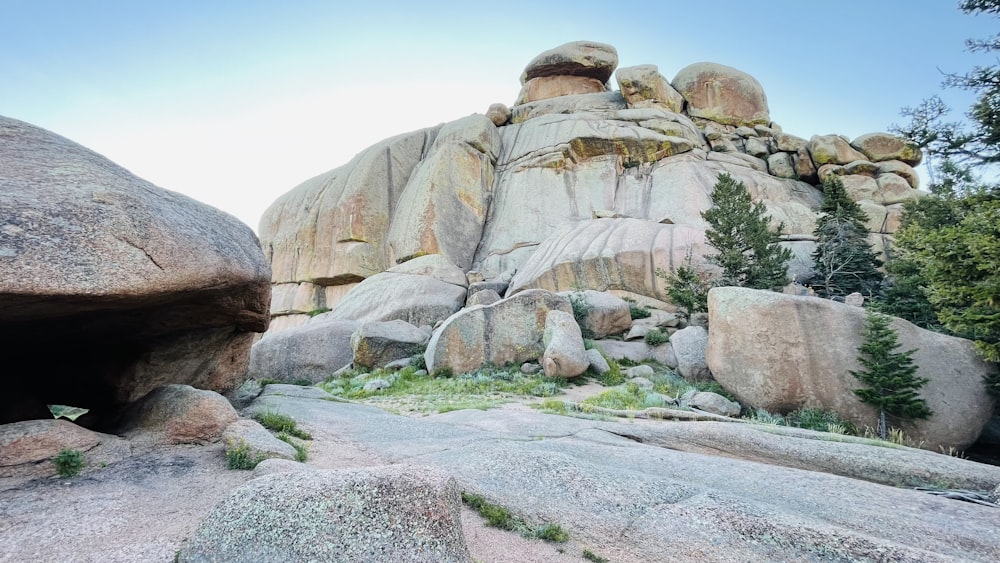 a large rock formation with a cave in the middle of it