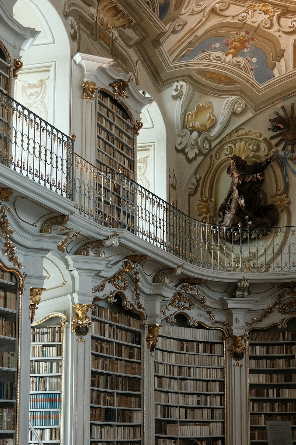 a room filled with lots of books in a library