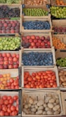 a bunch of boxes filled with different types of fruit