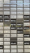 Array of traditional number plates lined up on a wooden display rack