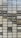 A collection of vintage license plates arranged in a grid, each displaying a different word. The plates are in two colors, black and white, and they feature a variety of words such as 'LOGICAL', 'NOVELTY', 'MUSICAL', and 'OUTPOST'. Each plate is bolted onto a metal mesh background.