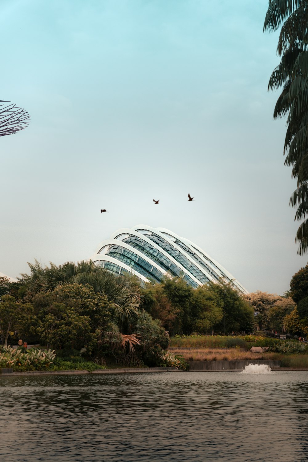 a large building sitting next to a body of water