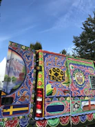 Before and after shots of a boldly painted red food truck with fresh bodywork.