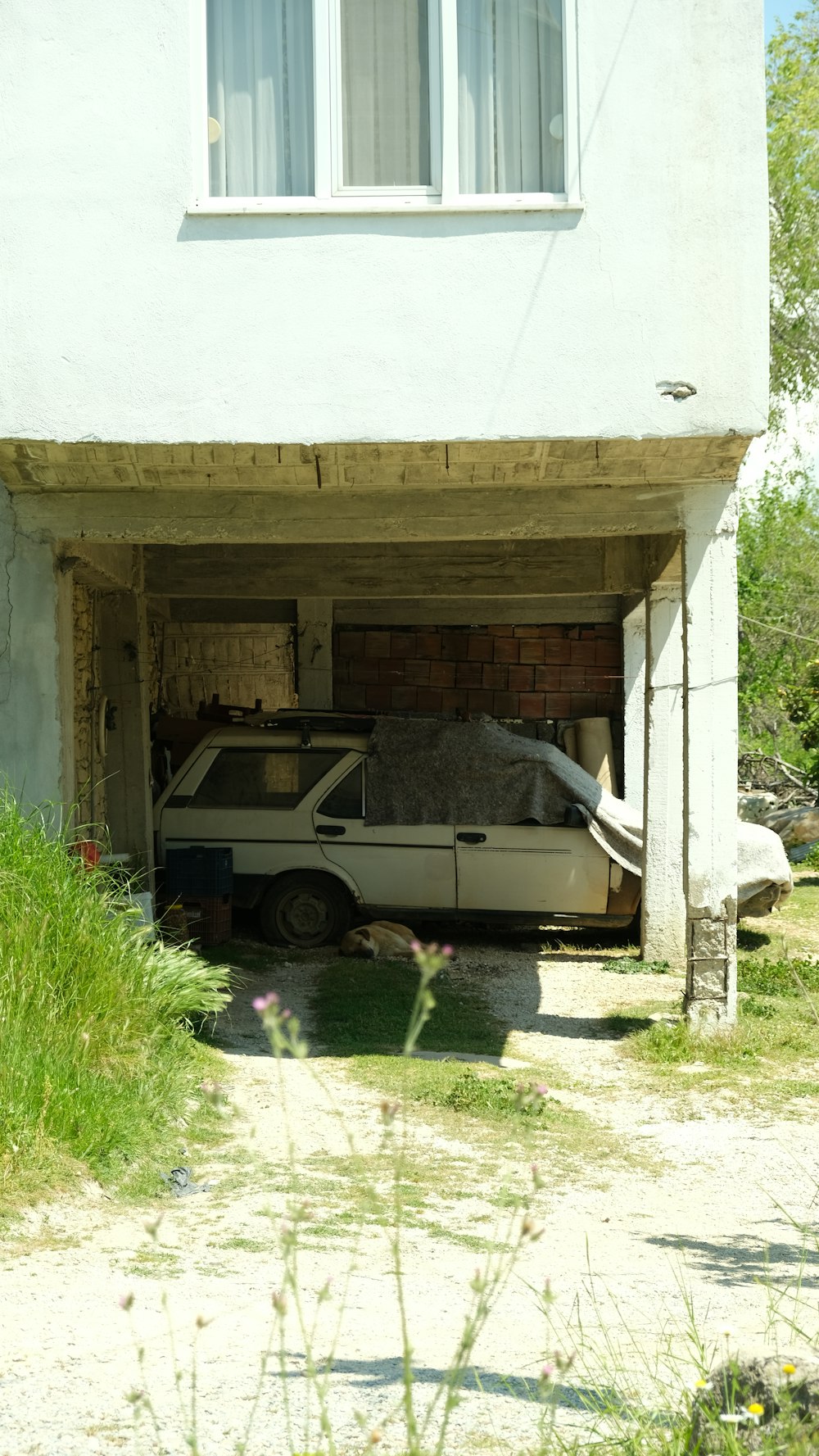 a white car is parked in a garage