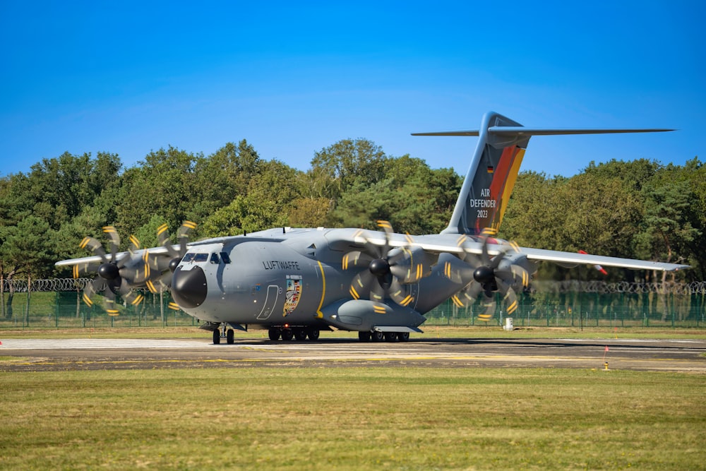 a large air plane sitting on top of an airport runway