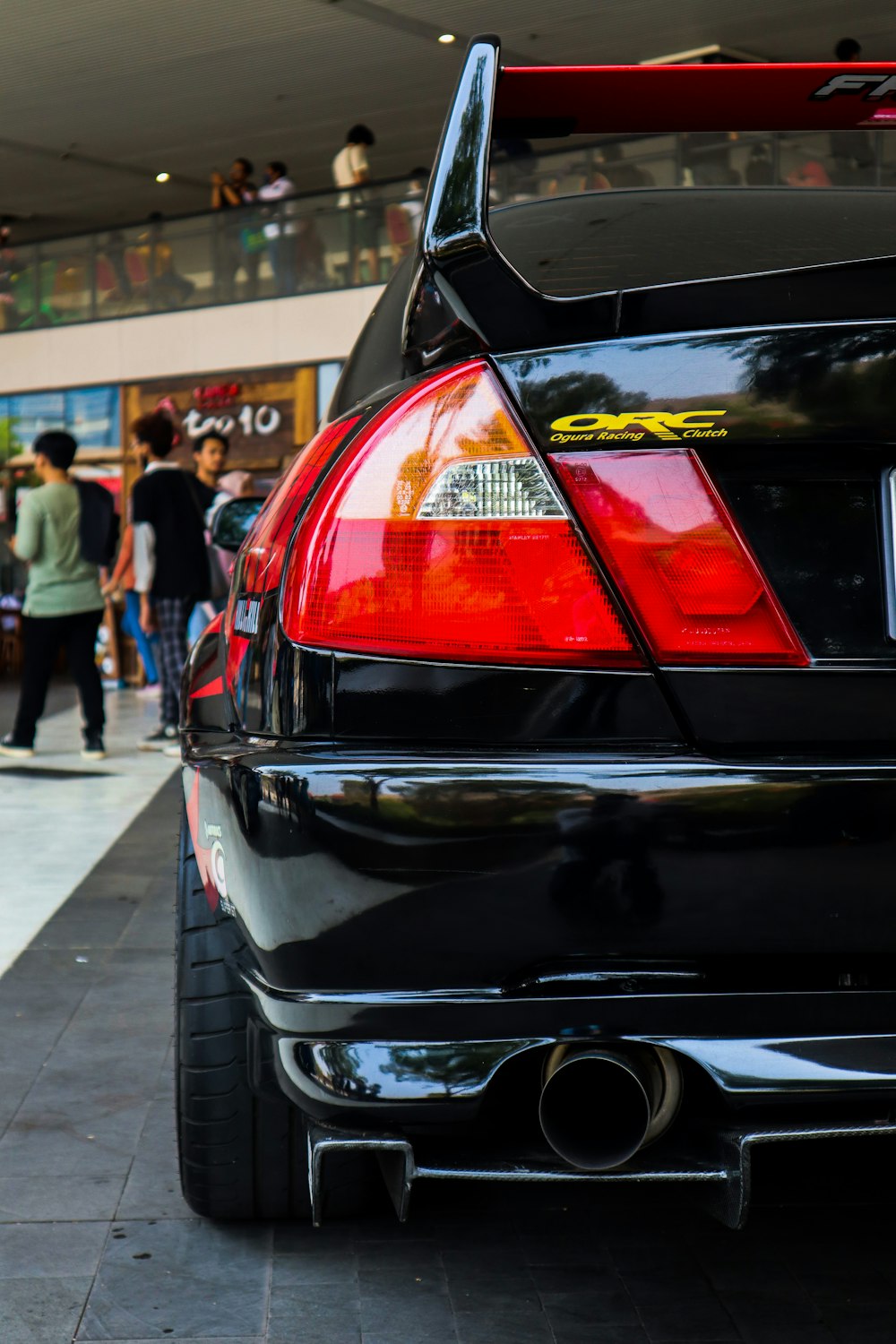 a black car parked in front of a building