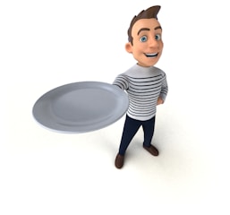 A cartoon-style character with brown hair and blue eyes is smiling while holding a large, empty plate. The character is wearing a white and black striped shirt, dark pants, and brown shoes. The overall posture suggests a welcoming gesture.