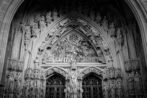 Close-up of intricate carvings on a cathedral door, telling stories from ancient scriptures.